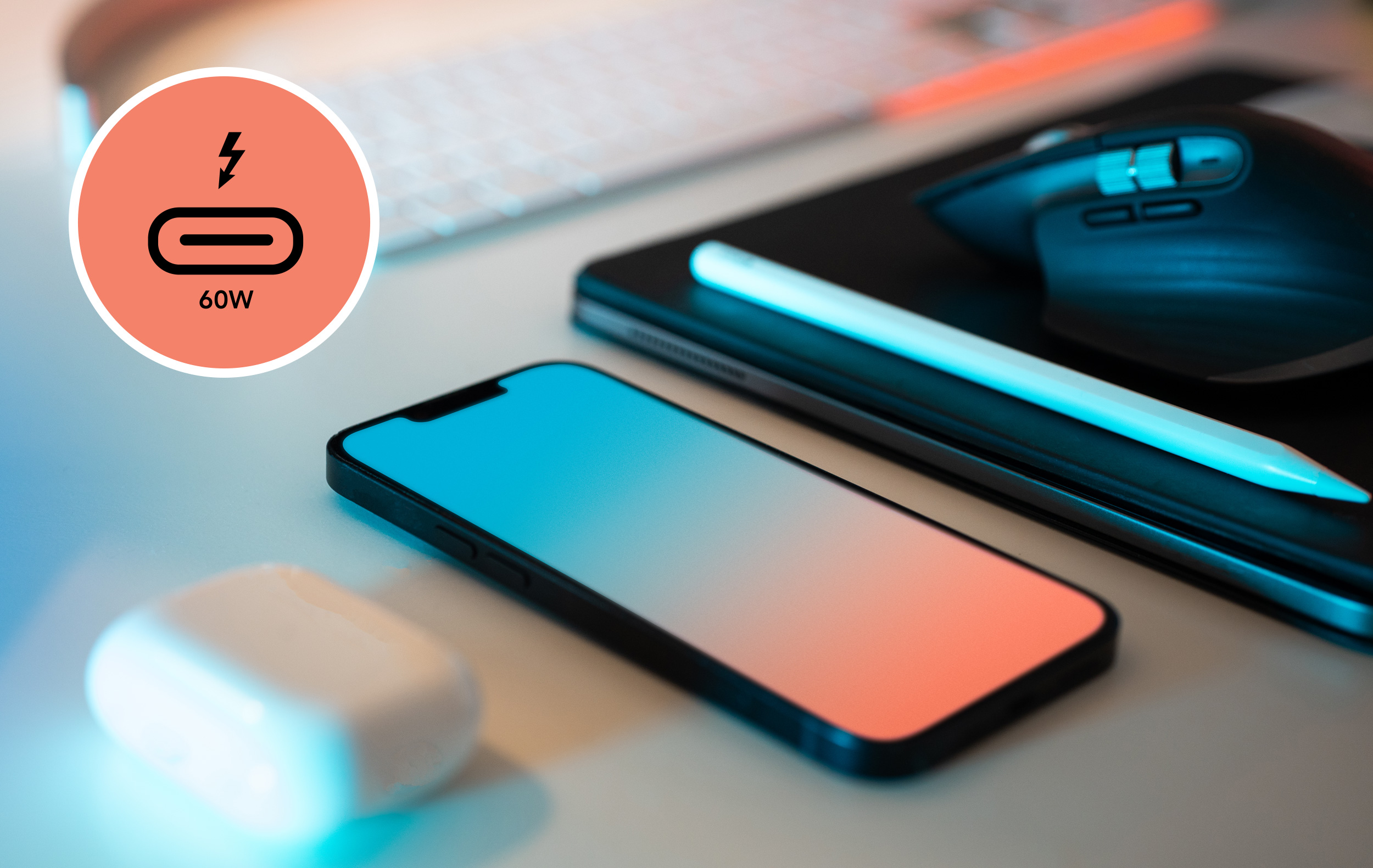 Close up of Apple iPhone, iPad, and AirPods laying on desk. Sonnet USB 10Gbps port charging icon badge shown superimposed in the upper left corner of the photo.