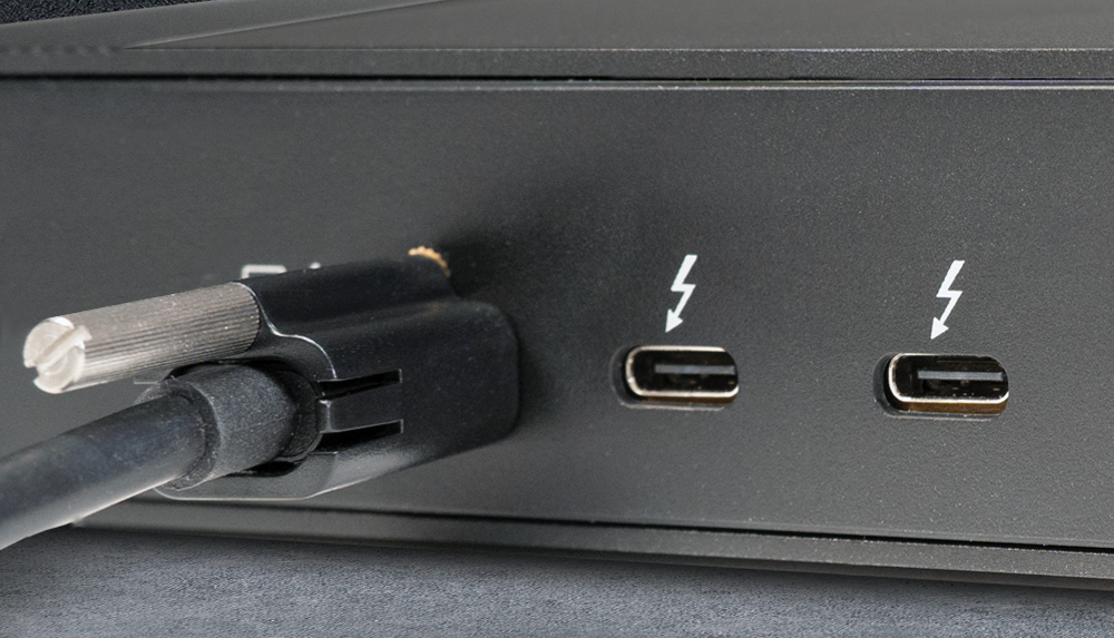 Thunderbolt 5 cable secured to Thunderbolt host port with ThunderLok.